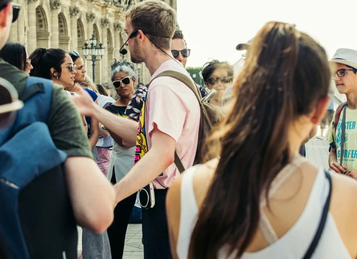 People listening to a tour guide